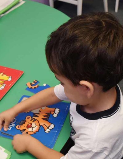 Boy doing a puzzle at Sumlar Therapy Services, Inc