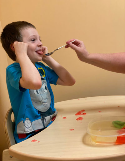 Toddler eating food at Sumlar Therapy Services, Inc