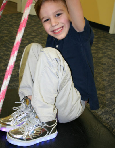 Boy playing with a rope at Sumlar Therapy Services